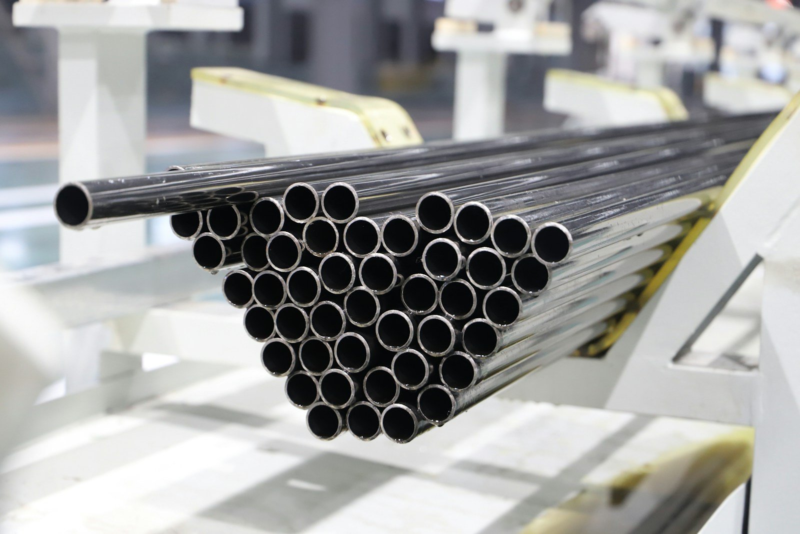 Stacks of metal pipe on a factory line — illustrative stock photo
